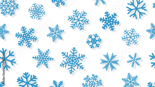 Christmas background of snowflakes of different shapes and sizes with shadows. Light blue on white