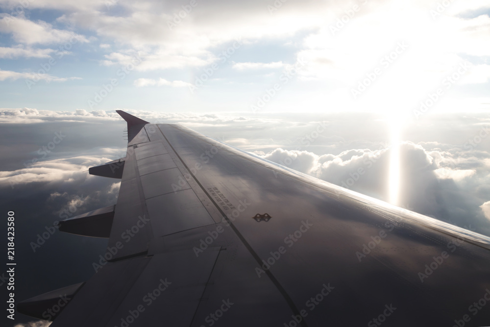 Fototapeta premium Beautiful view from airplane. The tourist is flying on vacation