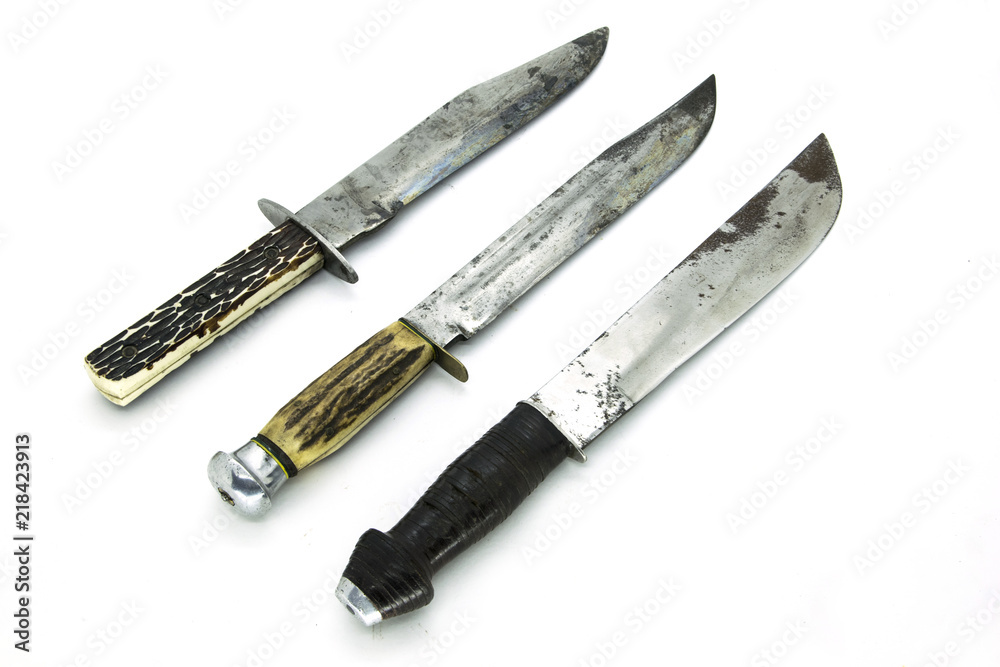 Studio shot of Old Dagger Knifes isolated in white background Studio shot of Old Dagger Knifes isolated in white background