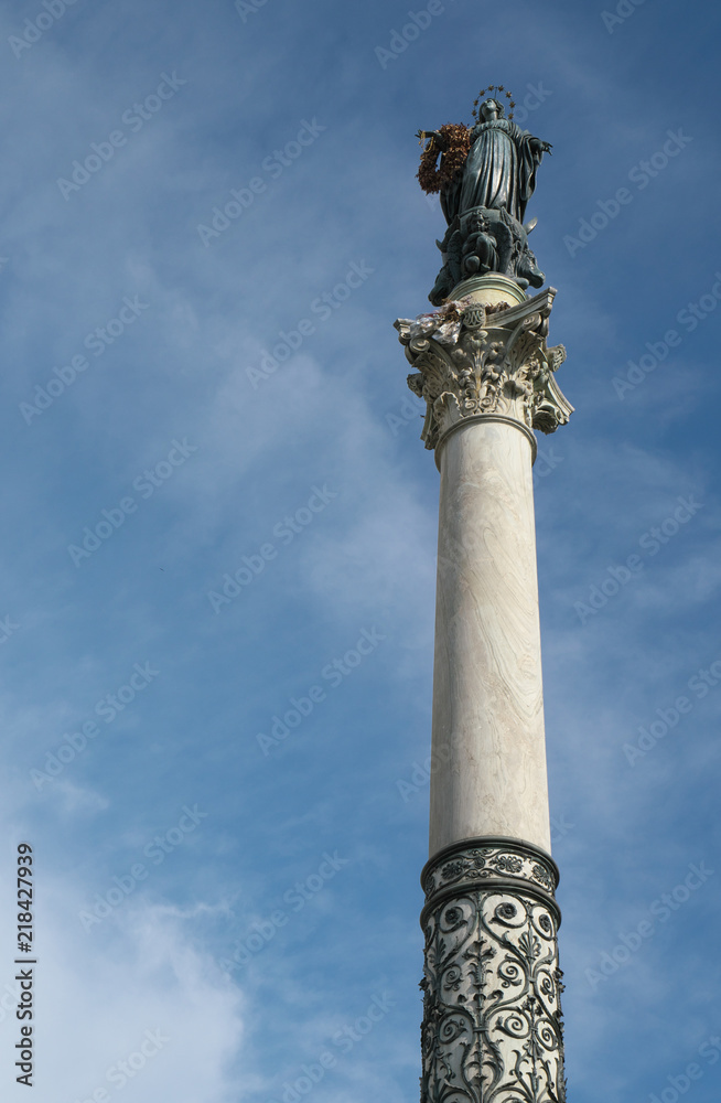 Rome,Italy-July 27, 2018: Column of the Immaculate Conception carrying a wreath of flowers