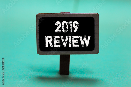 Text sign showing 2019 Review. Conceptual photo seeing important events or actions that made previous year Blackboard green background important message ideas communicate reflections.