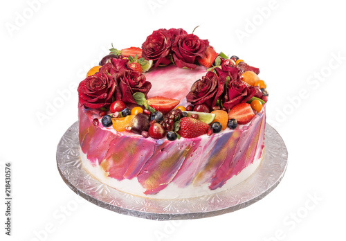 Delicious cake decorated with flowers and fruits. On birthday.
