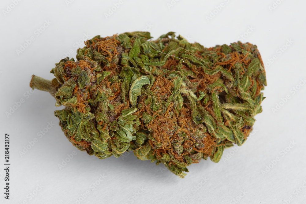 Close up of recreational and prescription medical marijuana indica flower bud isolated on a white background Close up of recreational and prescription medical marijuana indica flower bud isolated on a white background