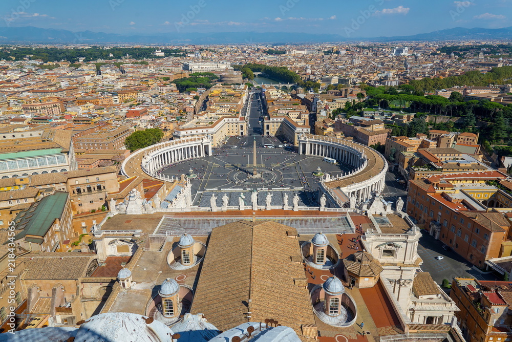 Aerial top view of St. Peter's Square and Vatican Obelisk from the roof top of Saint Peter Basilica. Panoramic view of Rome, Vatican city, Castel Sant'Angelo, riverside of Tiber river in Rome, Italy.