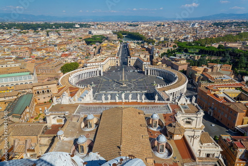 Aerial top view of St. Peter's Square and Vatican Obelisk from the roof top of Saint Peter Basilica. Panoramic view of Rome, Vatican city, Castel Sant'Angelo, riverside of Tiber river in Rome, Italy.