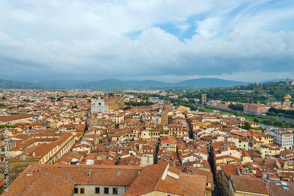 Top panoramic cityscape view of  medieval city Florence, capital of Tuscany region, plenty of roof top renaissance architectures and riverside of Arno river in Florence, Italy