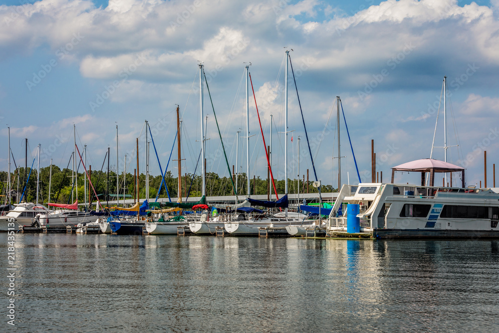 Sail Boats at a marina on a lake.