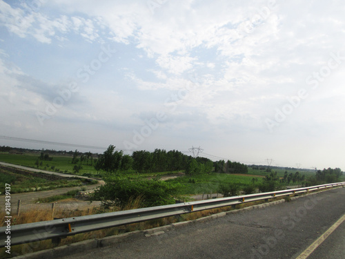 blue sky clouds trees and landscape