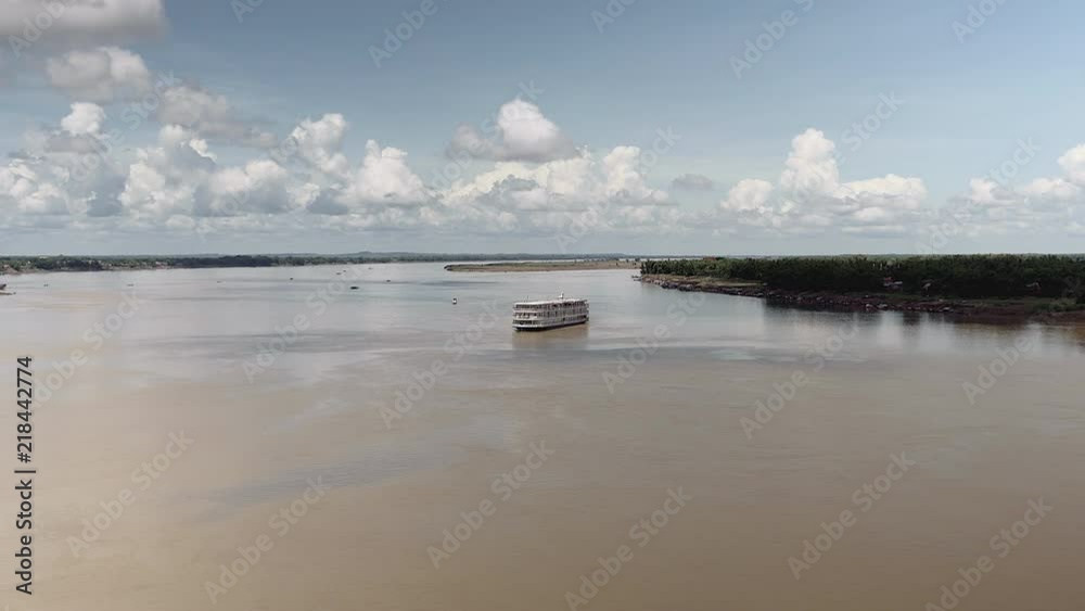 long distance view of a river cruise ship reaching port