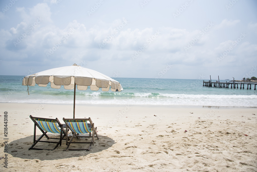 Two beach chairs on the sand beach