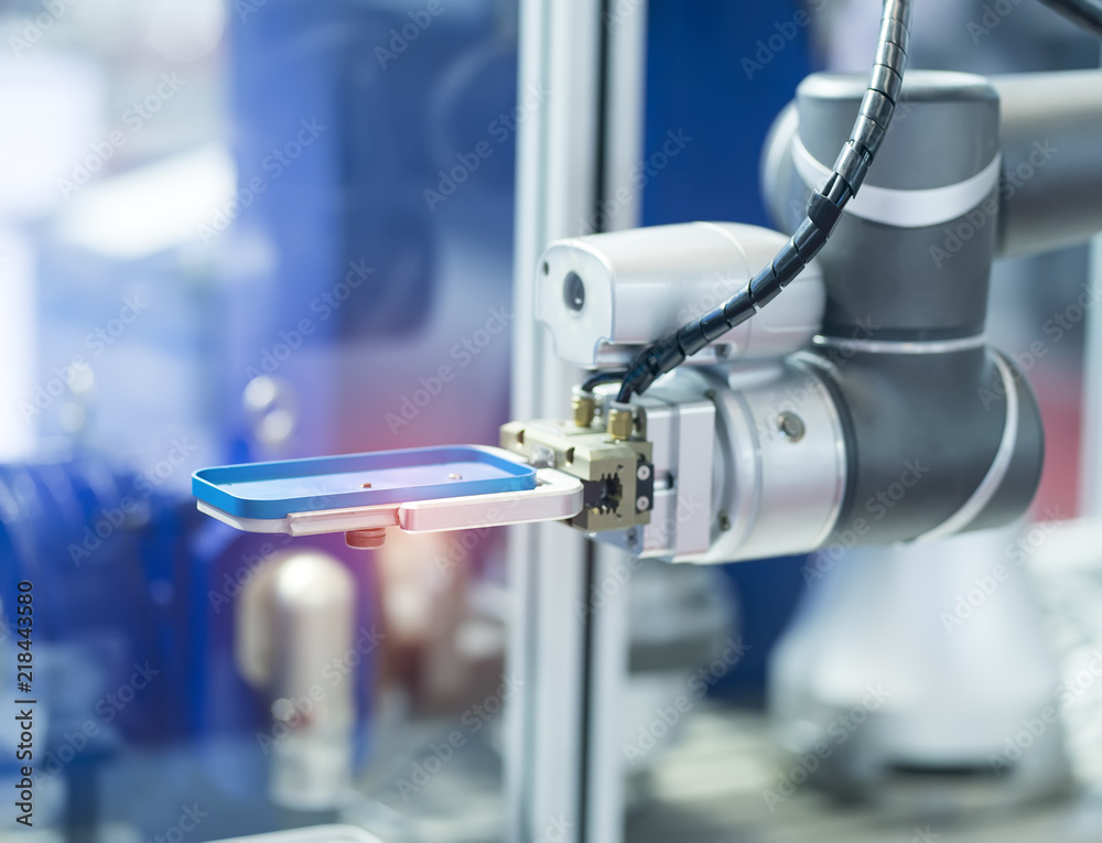 robot arm working in phone factory robot arm working in phone factory