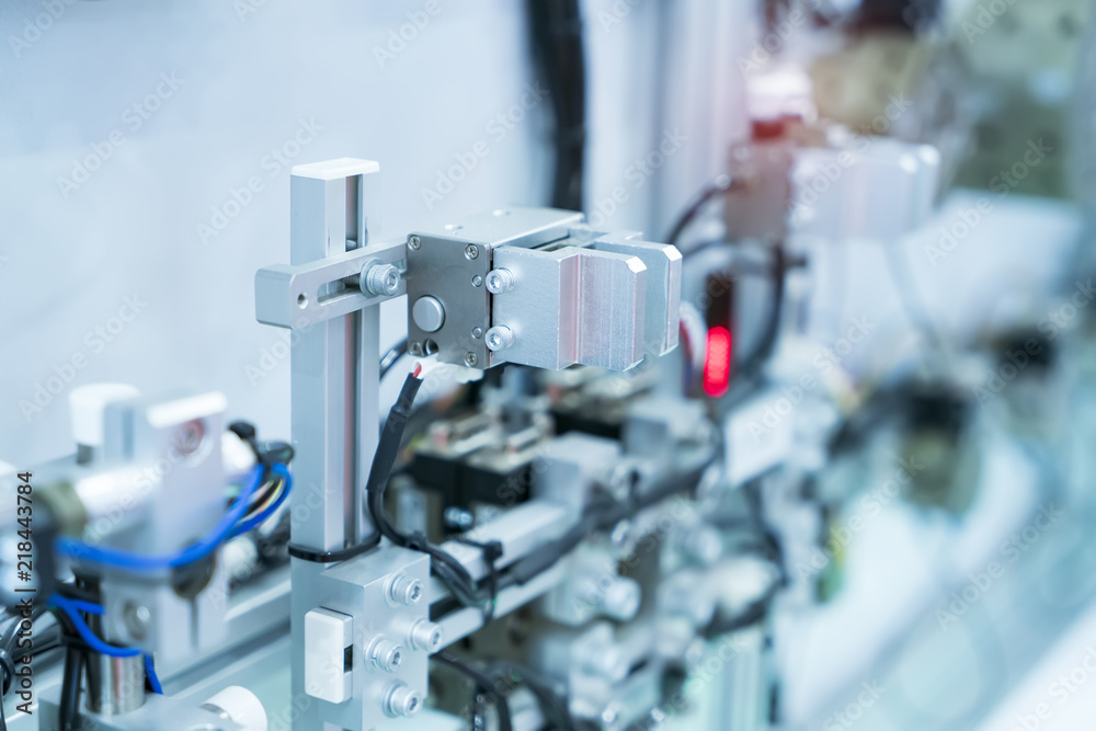 industrial engineer working with machine.Smart factory use Automation robot arm industrial engineer working with machine.Smart factory use Automation robot arm