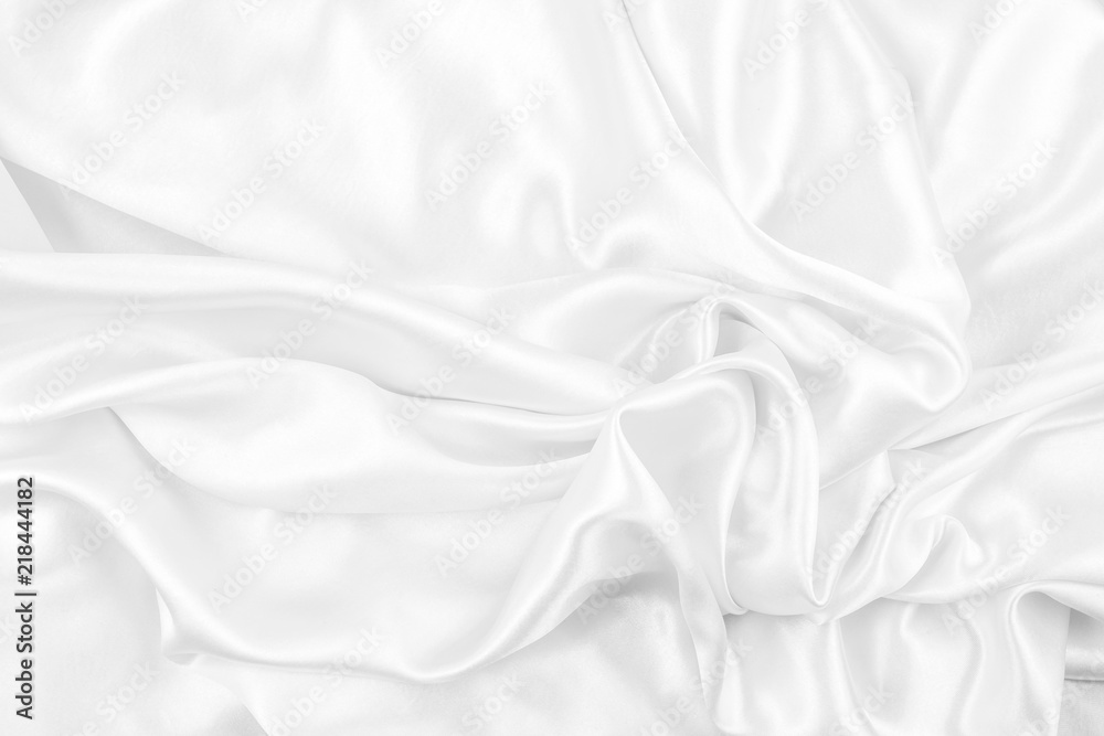 Luxurious of smooth white silk or satin fabric texture background Luxurious of smooth white silk or satin fabric texture background