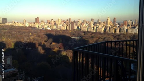 Shadows grow long across Central Park and uptown buildings during dusk sunset in Manhattan.