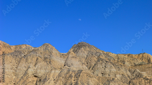 Rugged and Bare Mountains under the Blue Sky