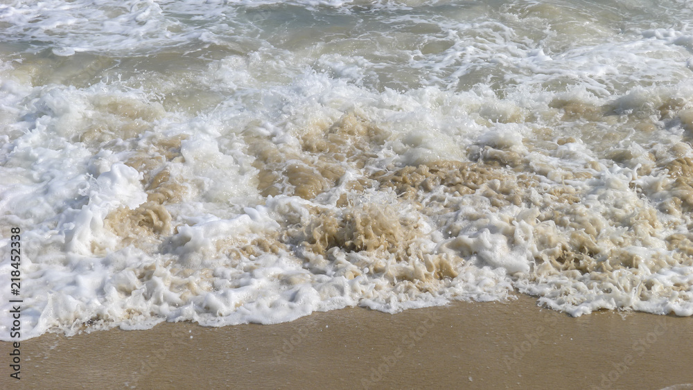 The wave flapped the coast and stirred layers of Spray