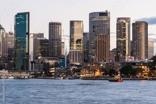 Fototapeta Naklejka Na Ścianę i Meble -  Stunning view of the sunset over the Sydney financial district skyline and the Circular Quay harbor in the Sydney bay in Australia largest city