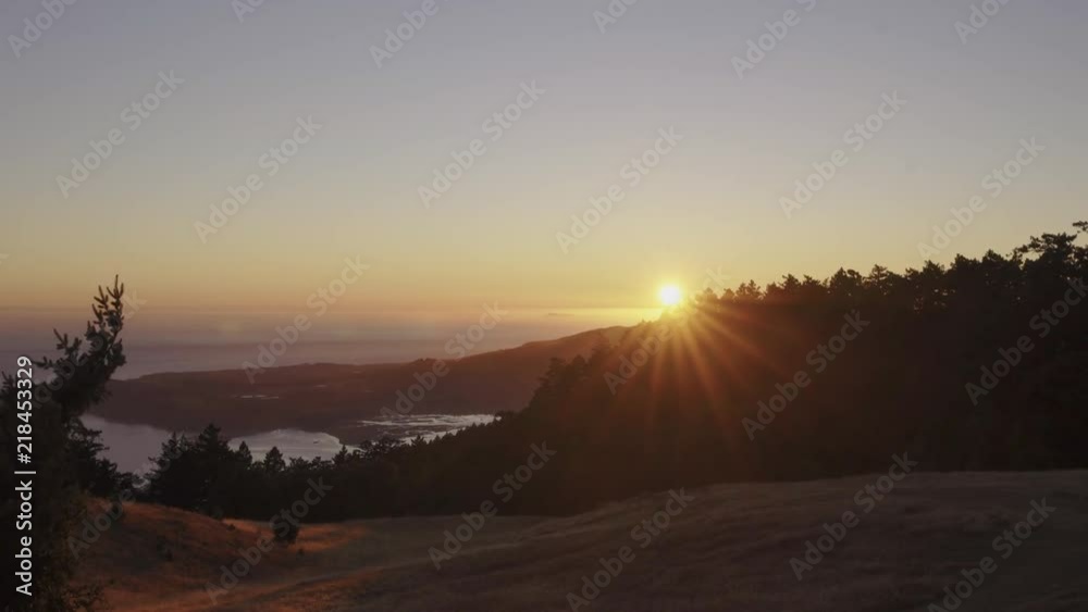 Timelapse of the sun setting over the San Francisco Bay Area, looking down at beach towns below from atop Mt Tamalpais. Timelapse of the sun setting over the San Francisco Bay Area, looking down at beach towns below from atop Mt Tamalpais.