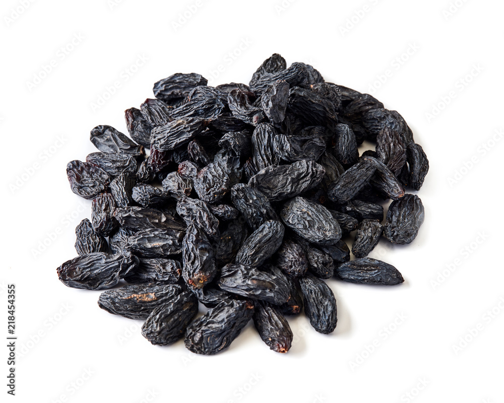 Heap of black raisins isolated on white background. Heap of black raisins isolated on white background.