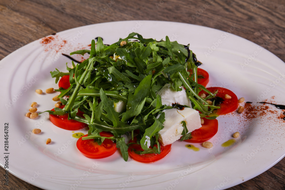 Caprese salad with arugula Caprese salad with arugula