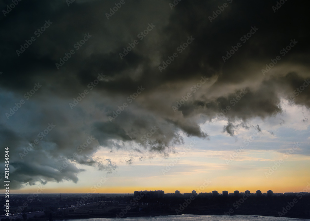 Sky before thunderstorm over the evening city