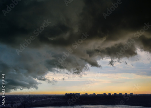 Sky before thunderstorm over the evening city