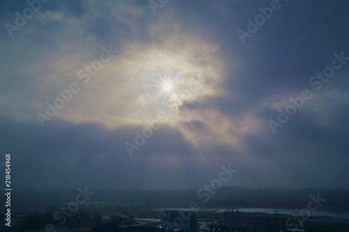 rays of the Sun through the fog and clouds