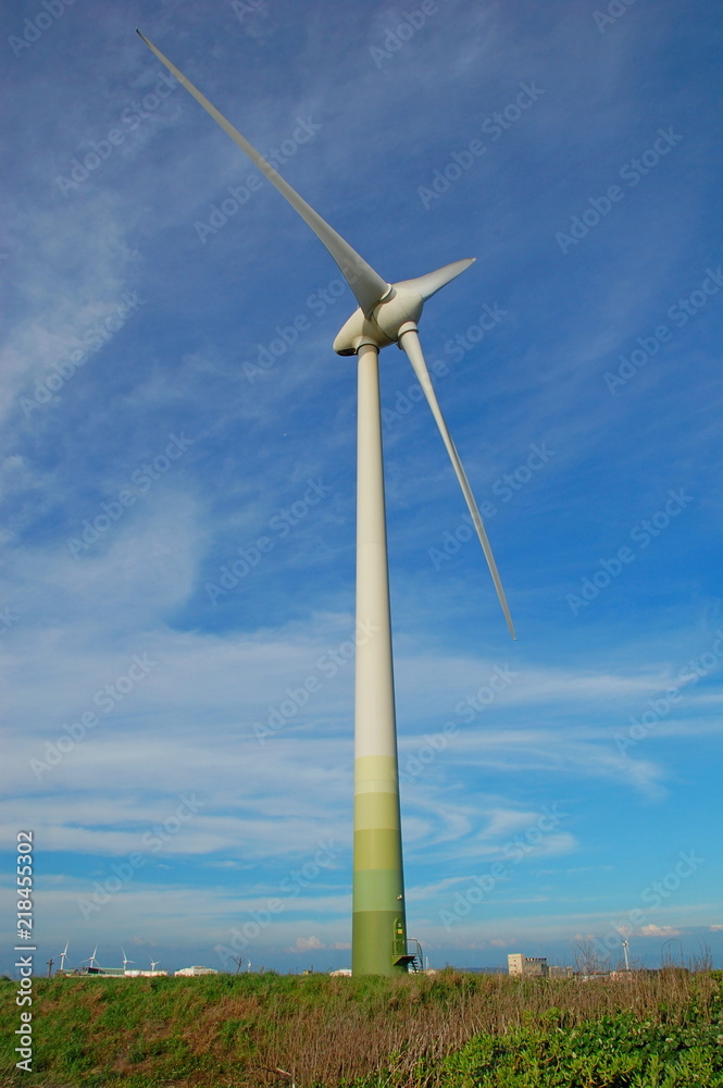 Wind turbines at sunset at a beach in Changhua, Taiwan Wind turbines at sunset at a beach in Changhua, Taiwan