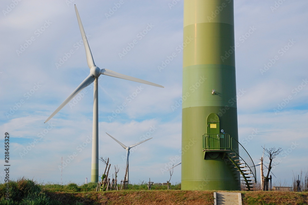 Wind turbines at sunset at a beach in Changhua, Taiwan Wind turbines at sunset at a beach in Changhua, Taiwan