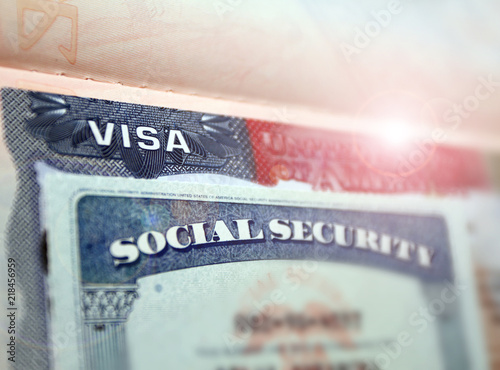 The American visa in a passport page (USA) background and sacial security nember personal document. SSN – social security number for live in America - selective focus photo