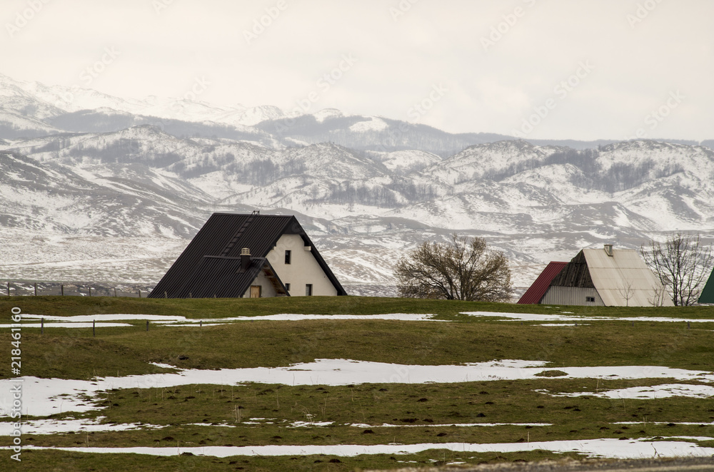 Country houses in Durmitor mountains in early spring. Zabljak, northern Montenegro