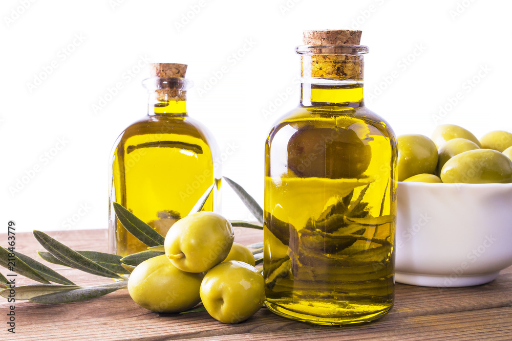 bottles of extra virgin olive oil and bowl of olives isolated on white bottles of extra virgin olive oil and bowl of olives isolated on white