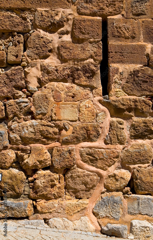 Fototapeta premium A fragment of the old stone masonry close-up.