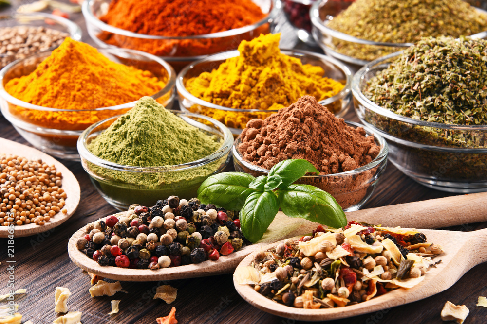 Variety of spices and herbs on kitchen table