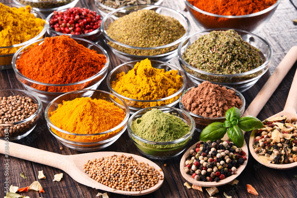 Variety of spices and herbs on kitchen table