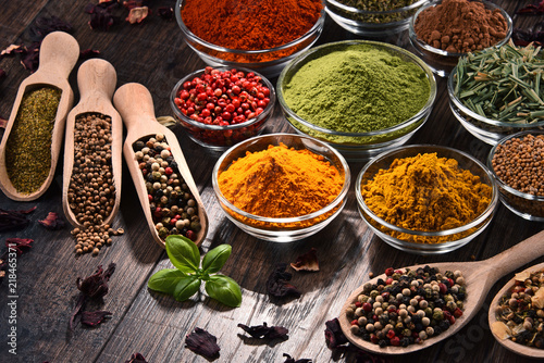 Fototapeta Naklejka Na Ścianę i Meble -  Variety of spices and herbs on kitchen table