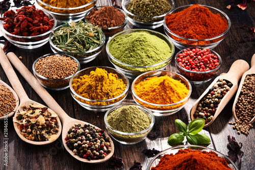 Fototapeta Naklejka Na Ścianę i Meble -  Variety of spices and herbs on kitchen table