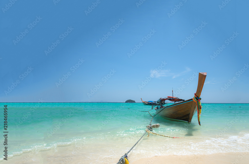 Landscape view of beautiful beach and boat, sea sand sun at Lipe, Sa Toon province in south of Thailand with blue sky,white beach for relax, vacation,long holidays to driving scuba tropical Island Landscape view of beautiful beach and boat, sea sand sun at Lipe, Sa Toon province in south of Thailand with blue sky,white beach for relax, vacation,long holidays to driving scuba tropical Island