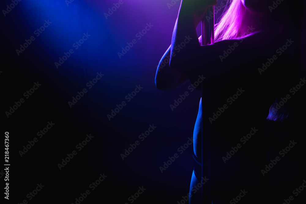 Young slim pole dance woman in bright interior Young slim pole dance woman in bright interior