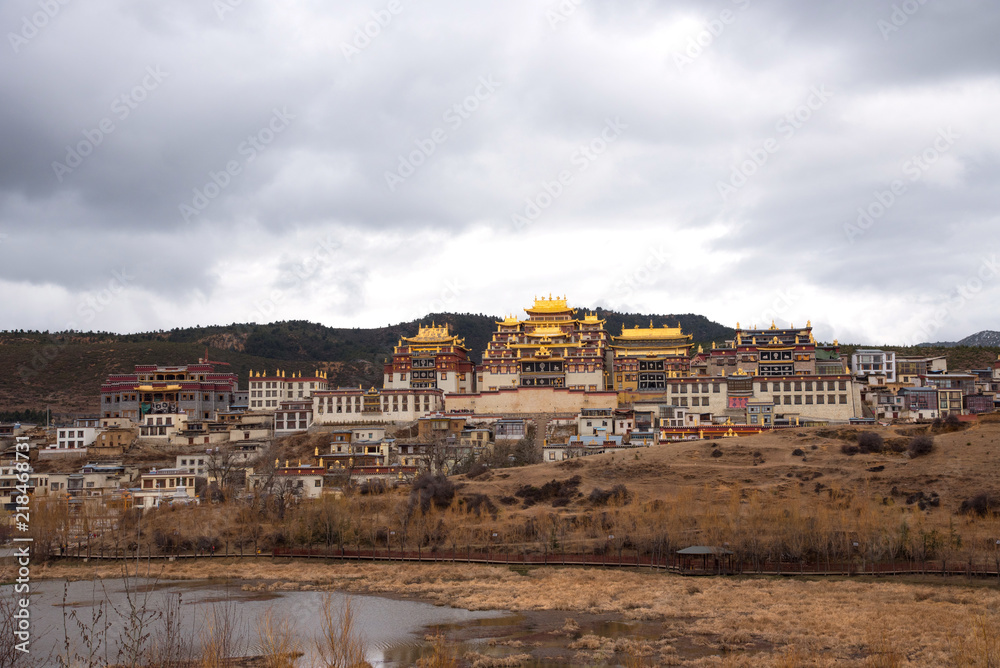 Landscape view of Songzanlin monastery temple, temple of Buddhism in Shangri-la, China, golden traditional temple landmark and famous place for travel