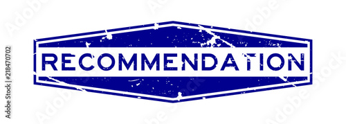 Grunge blue recommendation wording hexagon rubber seal stamp on white background