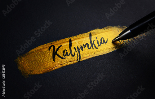 Kalymkia Handwriting Text on Golden Paint Brush Stroke