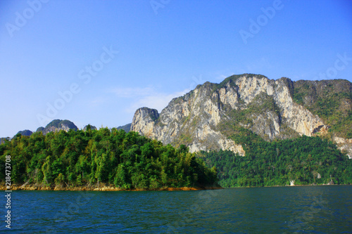 Landscape of Dam with Mountain and river near forest hills in Blue sky at Ratchaprapha Dam at Khao Sok National Park  Surat Thani Province  Thailand.