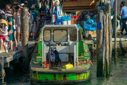 Industrial boat docked in Venice Italy near by the Rialto Bridge  © Florincristian