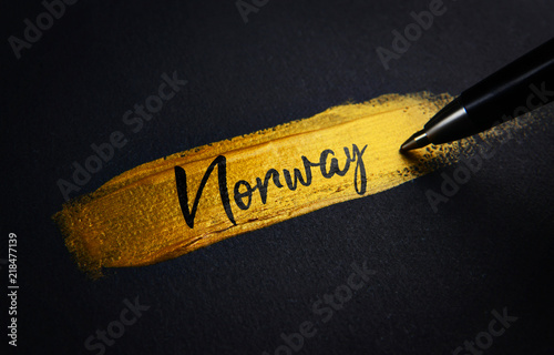 Norway Handwriting Text on Golden Paint Brush Stroke