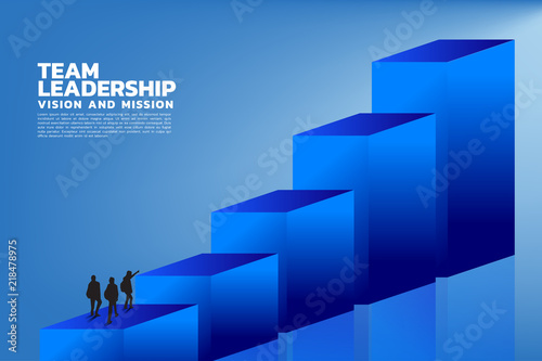 Silhouette of a team leader look up to top of graph, Concept of teamwork, leadership, Goal, Mission and Vision, growth arrow.