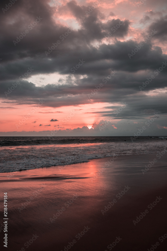 Sunrise or sunset at the beach with nice reflection in the water