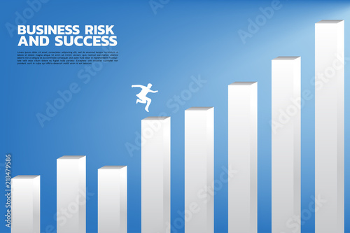 PSilhouette of businessman jump to higher column of graph. Concept of risk and success in business