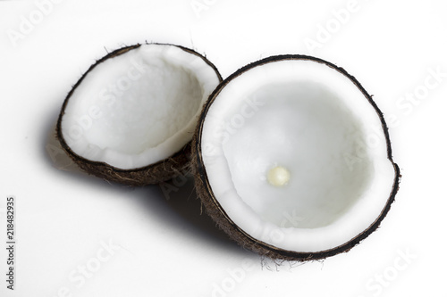 coconut broken isolated on a white background for making coconut milk , Or cosmetics for the spa.