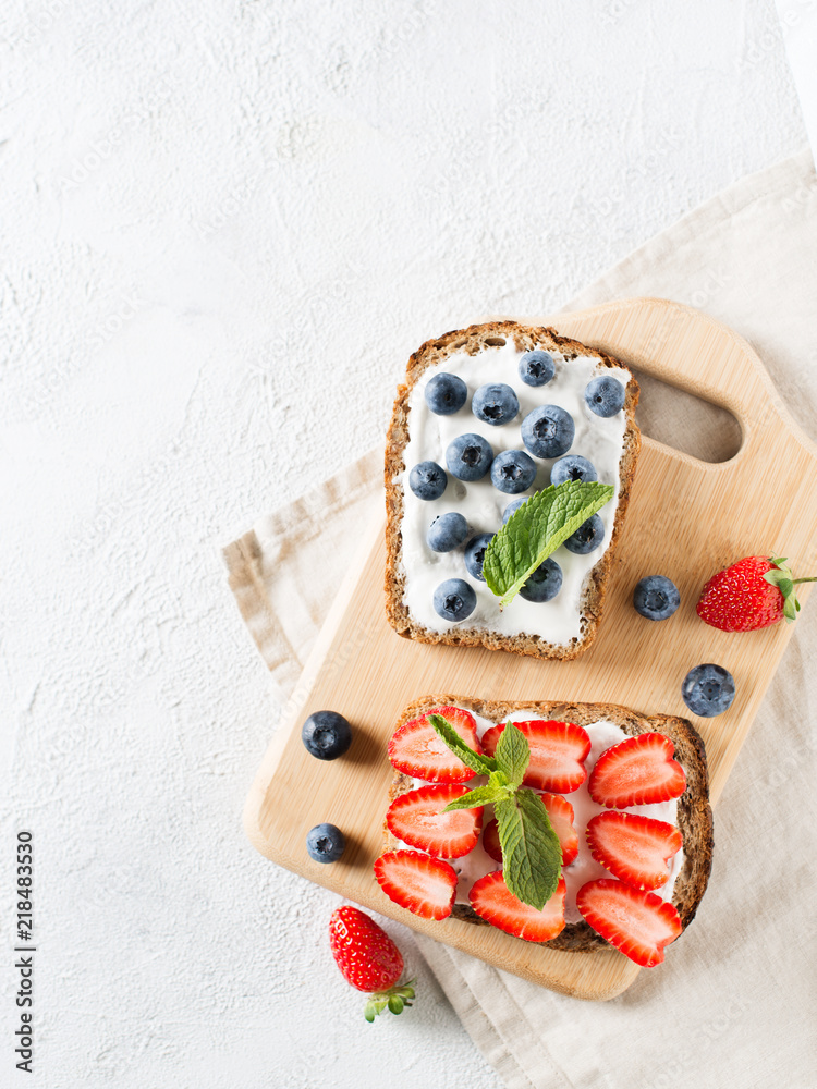 Strawberry and blueberry toast on breakfast on white background. Strawberry and blueberry toast on breakfast on white background.